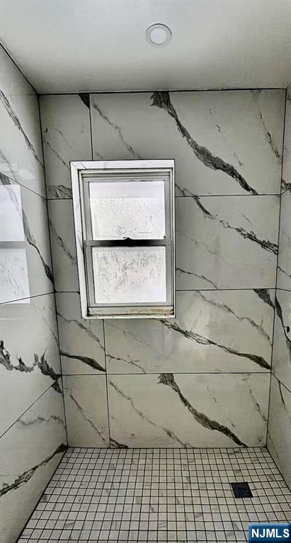 62 Howland Avenue Teaneck, NJ 07666 - Photo 17 of 31 a bathroom with a shower