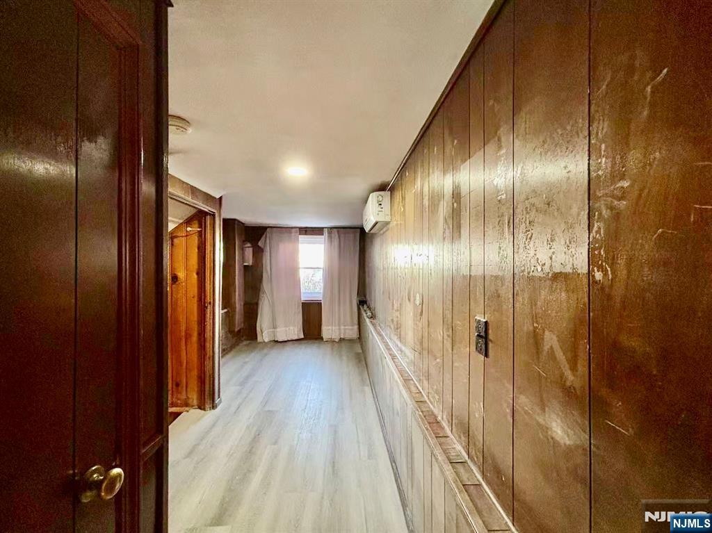 62 Howland Avenue Teaneck, NJ 07666 - Photo 19 of 31 a view of a hallway with wooden floor