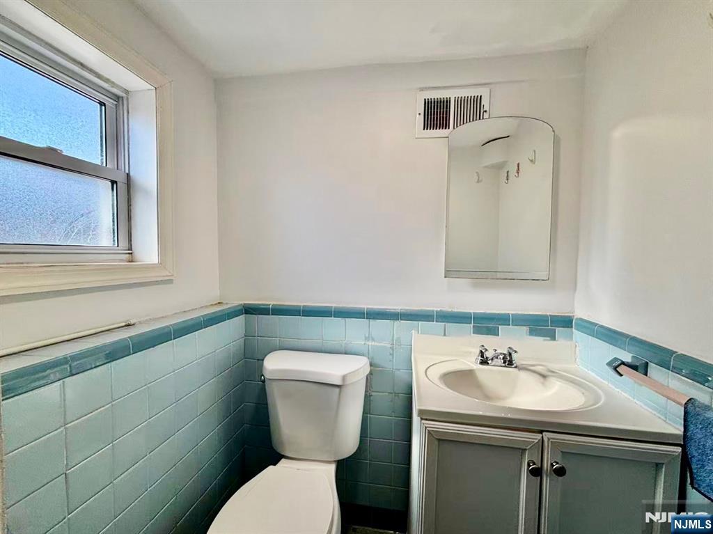 62 Howland Avenue Teaneck, NJ 07666 - Photo 20 of 31 a bathroom with a sink and a toilet