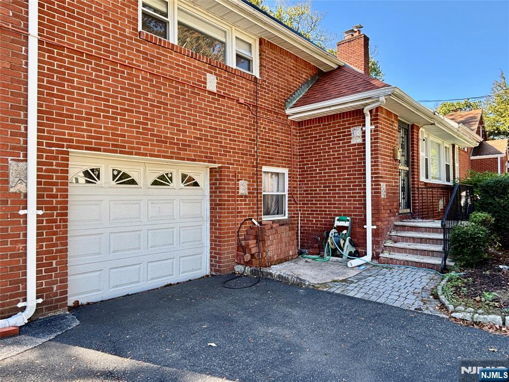 62 Howland Avenue Teaneck, NJ 07666 - Photo 2 of 31 a view of a house with a yard