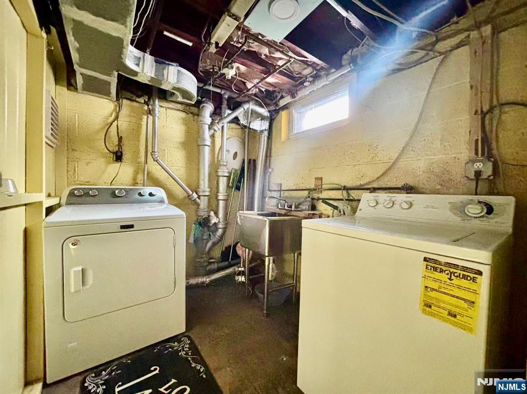 62 Howland Avenue Teaneck, NJ 07666 - Photo 23 of 31 a utility room with dryer and washer