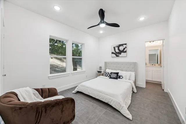a bedroom with a bed furniture and window