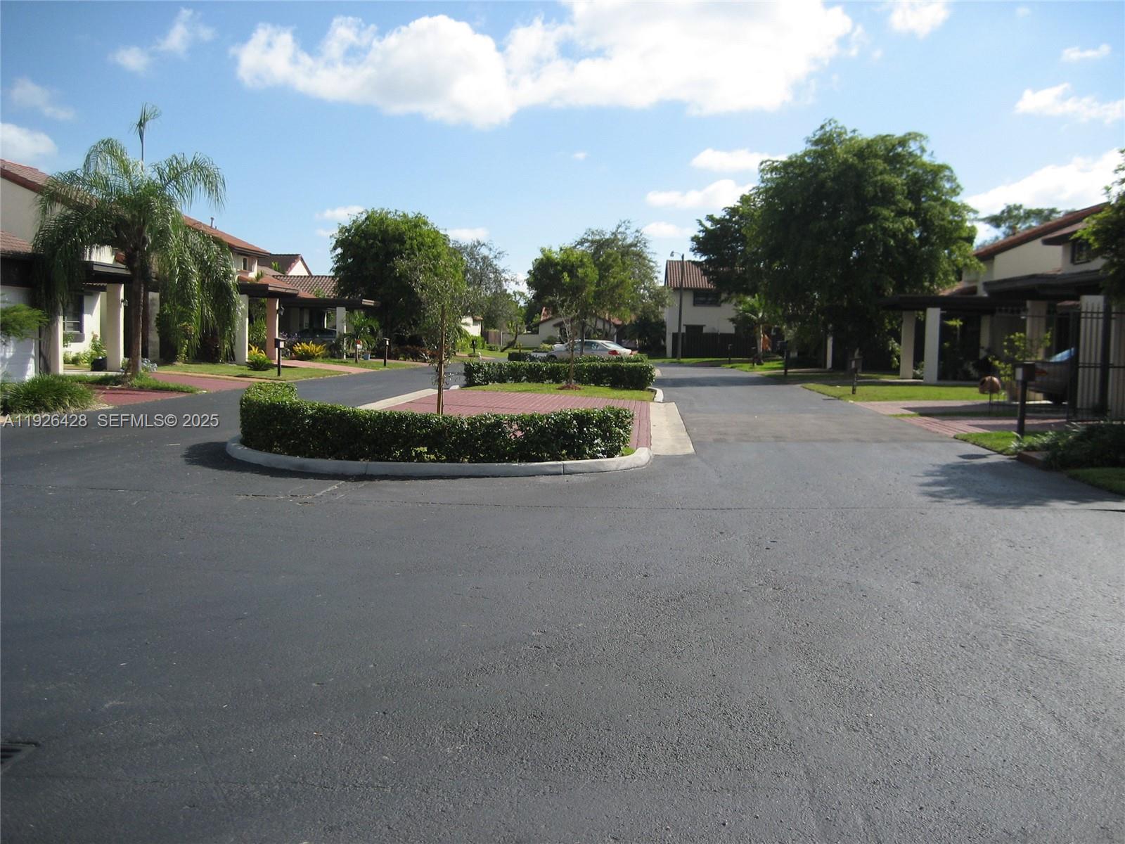 9044 Southwest 112th Court Miami, FL 33176 - Photo 16 of 19 a view of a street with a houses