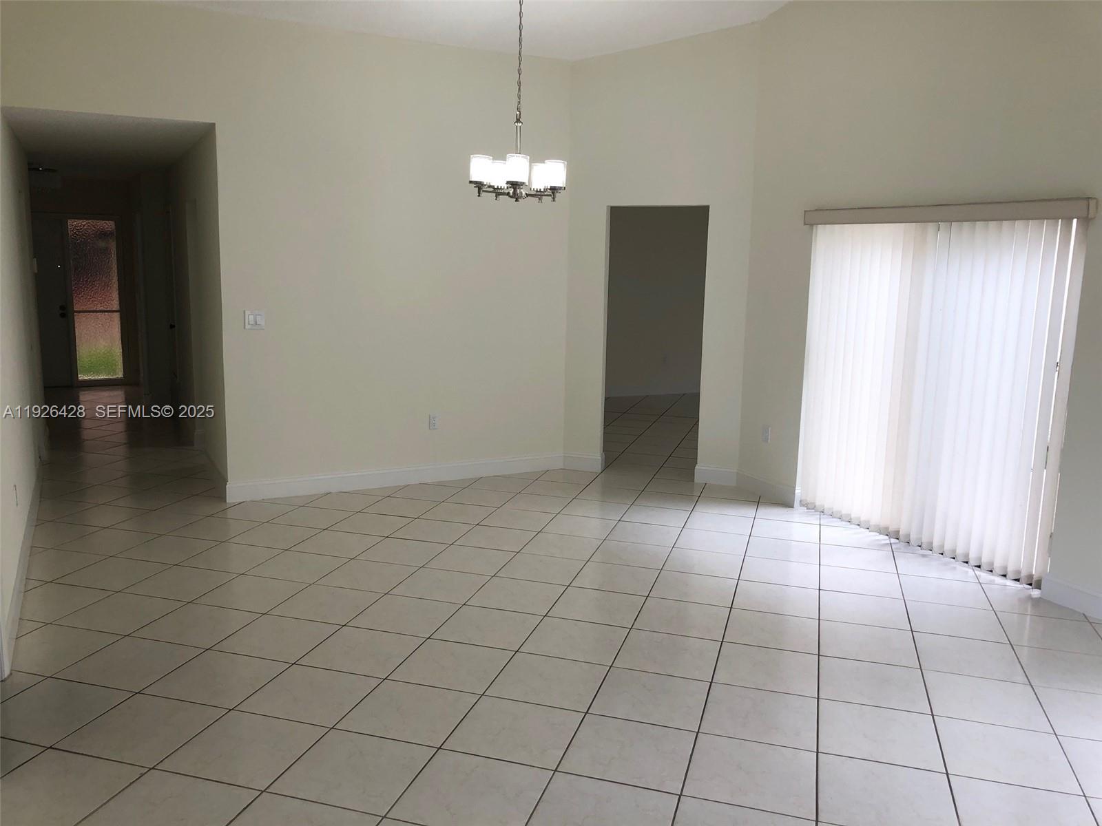 9044 Southwest 112th Court Miami, FL 33176 - Photo 6 of 19 a view of an empty room and window