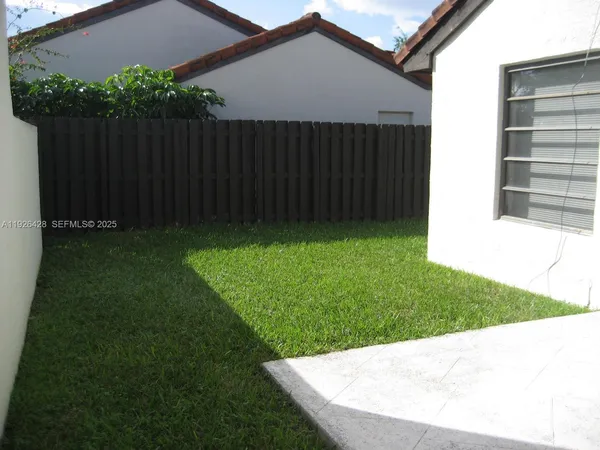 a view of backyard with green space