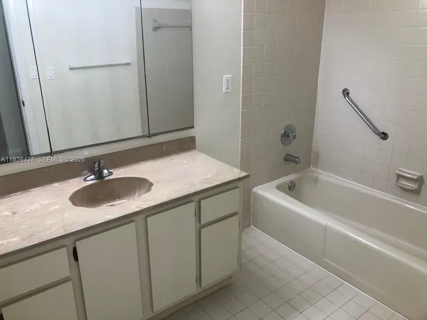 a bathroom with a sink and a bathtub