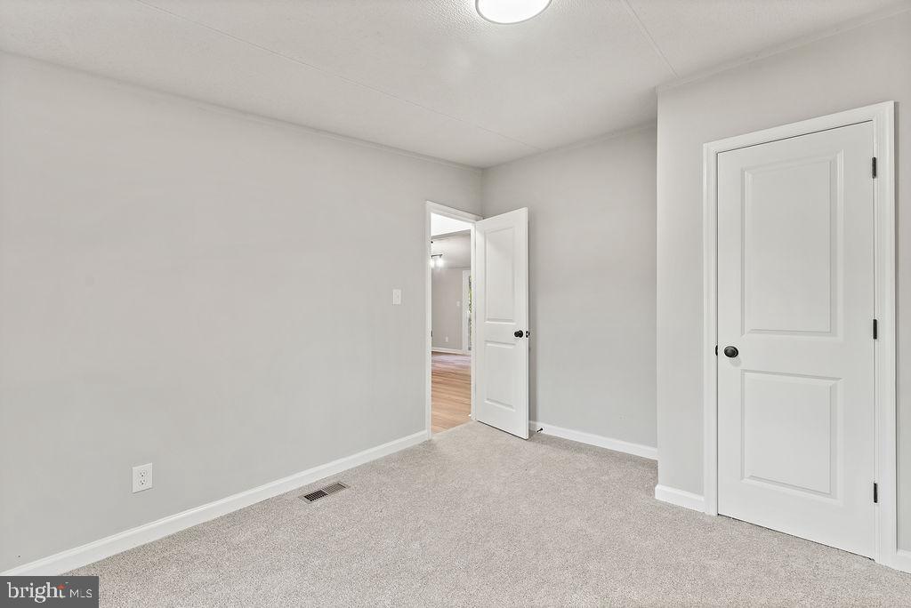 7261 Blanton Road Ruther Glen, VA 22546 - Photo 23 of 35 a view of an empty room and closet area