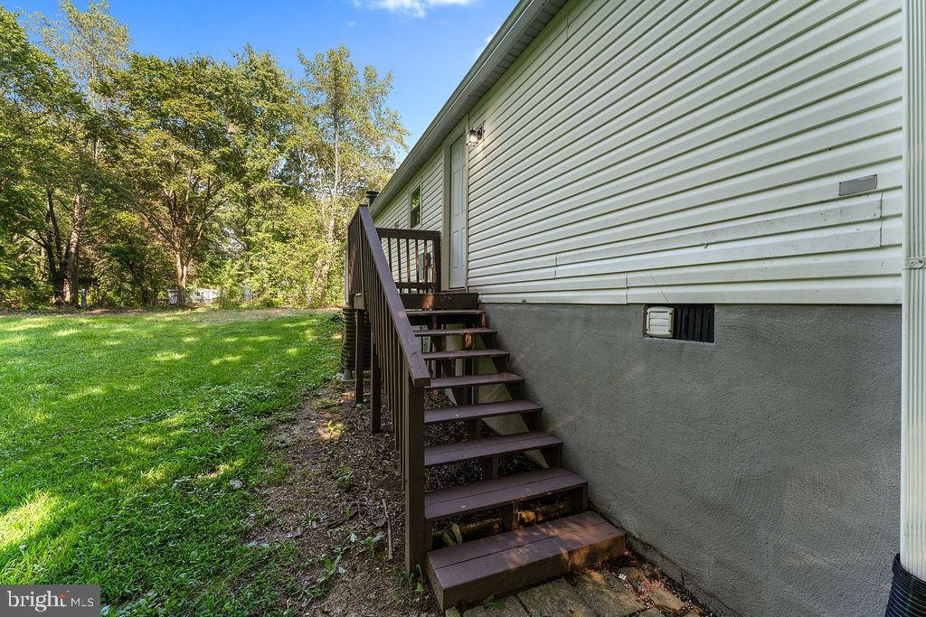 7261 Blanton Road Ruther Glen, VA 22546 - Photo 35 of 35 a view of a backyard with stairs and trees