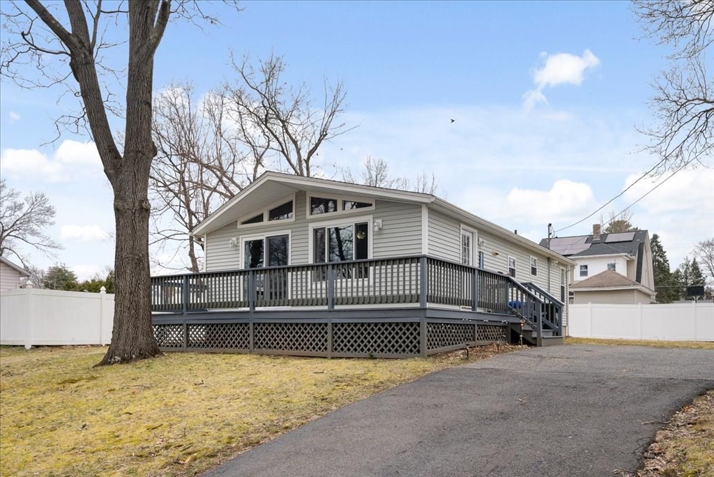 a view of a house with a snow in the yard