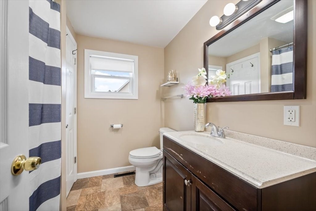 105 Geneva Street Springfield, MA 01151 - Photo 13 of 39 a bathroom with a sink mirror and toilet