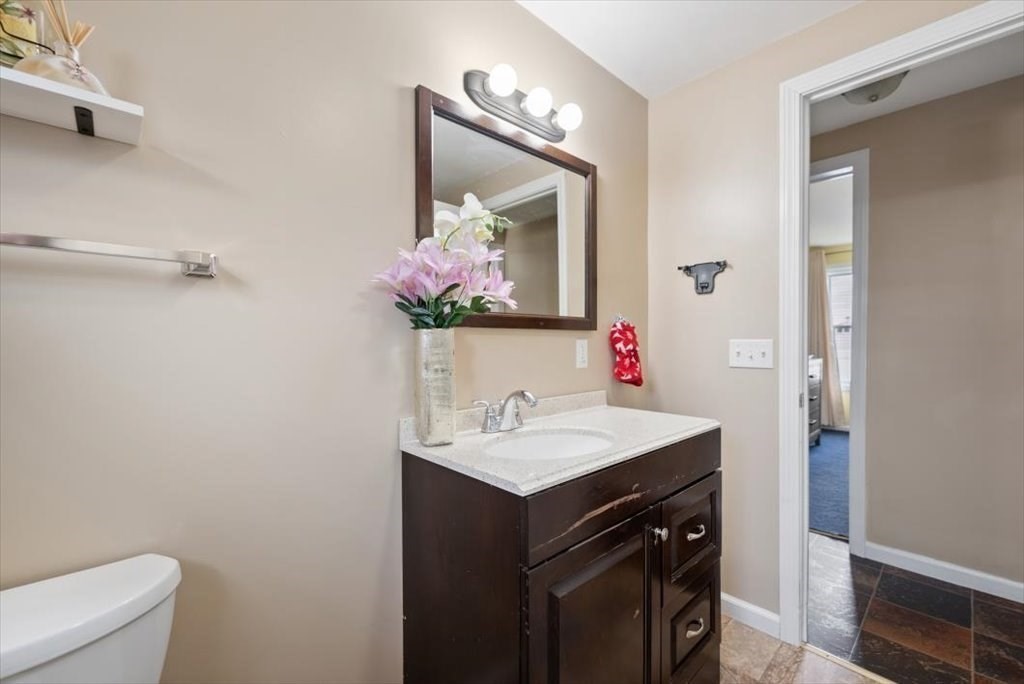 105 Geneva Street Springfield, MA 01151 - Photo 14 of 39 a bathroom with a sink vanity and a mirror