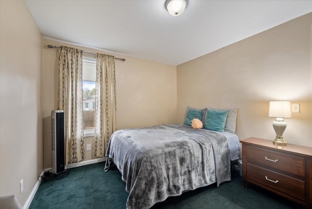 105 Geneva Street Springfield, MA 01151 - Photo 19 of 39 a bedroom with a bed and a window