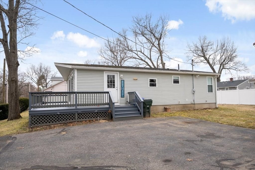 105 Geneva Street Springfield, MA 01151 - Photo 29 of 39 a view of a house with a yard