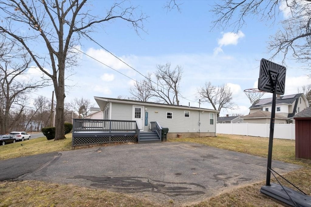 105 Geneva Street Springfield, MA 01151 - Photo 30 of 39 a view of a house with a yard