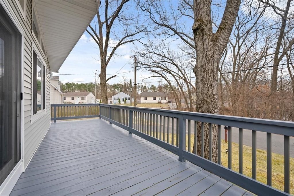 105 Geneva Street Springfield, MA 01151 - Photo 3 of 39 a view of a balcony with wooden floor