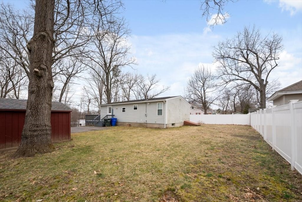105 Geneva Street Springfield, MA 01151 - Photo 33 of 39 a view of a house with a yard covered in snow