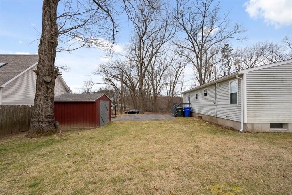 105 Geneva Street Springfield, MA 01151 - Photo 34 of 39 a view of backyard with large tree