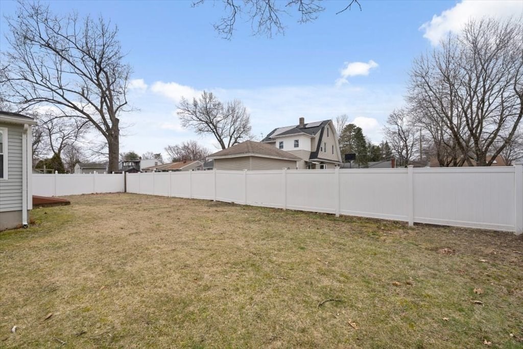 105 Geneva Street Springfield, MA 01151 - Photo 4 of 39 a view of a yard with a house