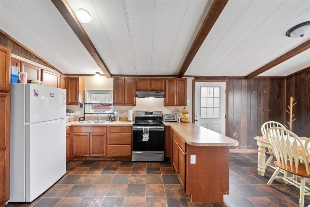 105 Geneva Street Springfield, MA 01151 - Photo 7 of 39 a kitchen with stainless steel appliances granite countertop a sink stove and refrigerator