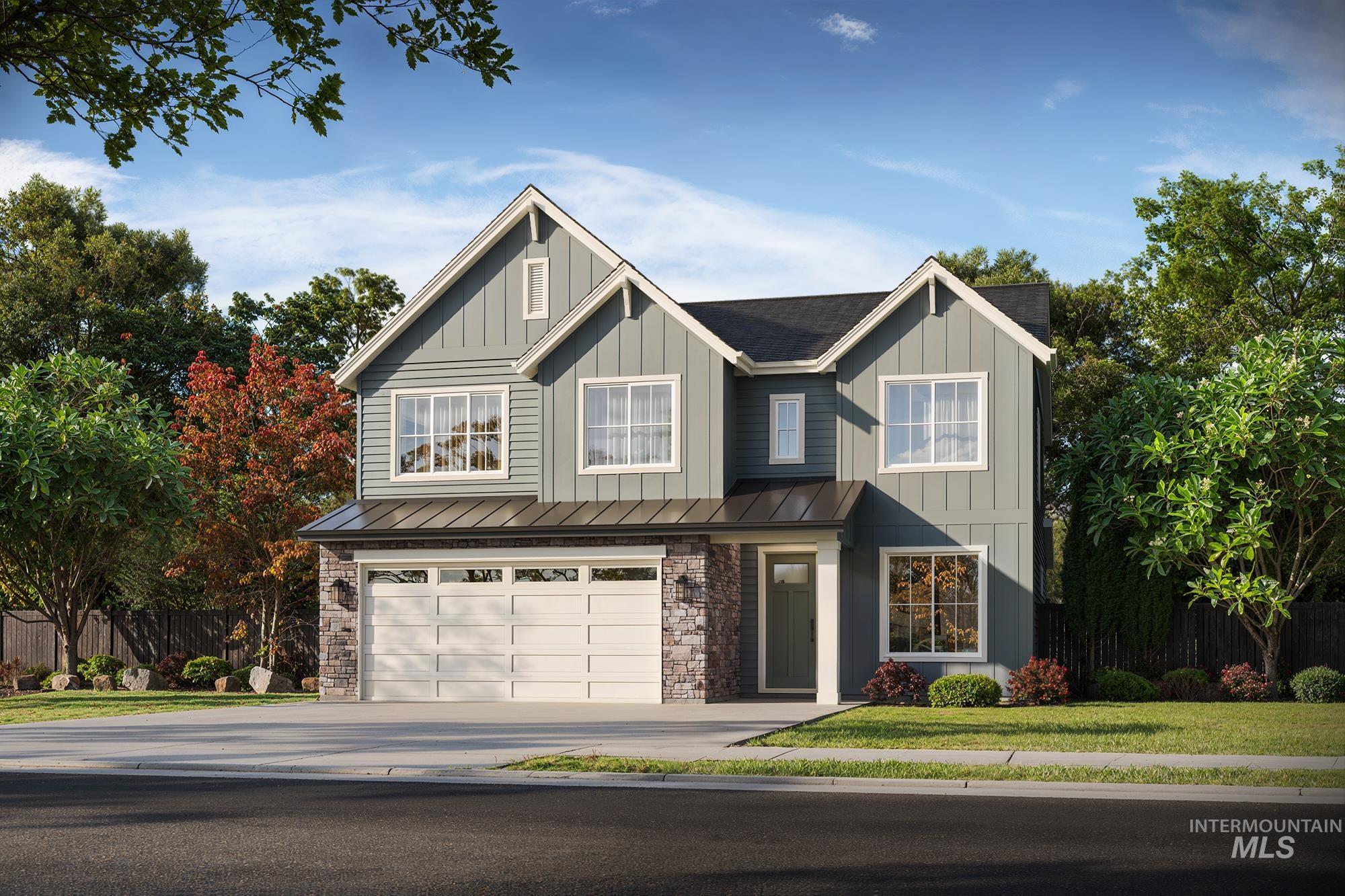 1719 East Acme Street Meridian, ID 83642 - Photo 1 of 3 Contemporary two-story residence featuring board and batten siding, stone facade accents, and a two-car garage