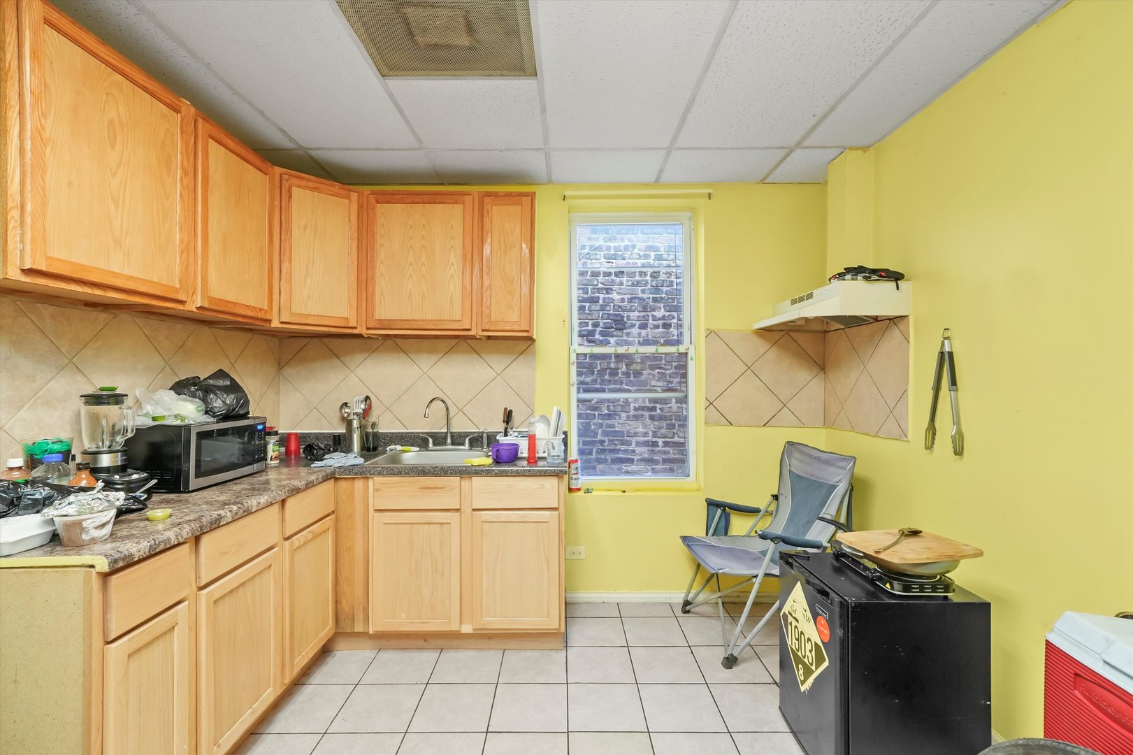 3020 South Pulaski Road Chicago, IL 60623 - Photo 18 of 44 a kitchen with a sink cabinets and appliances