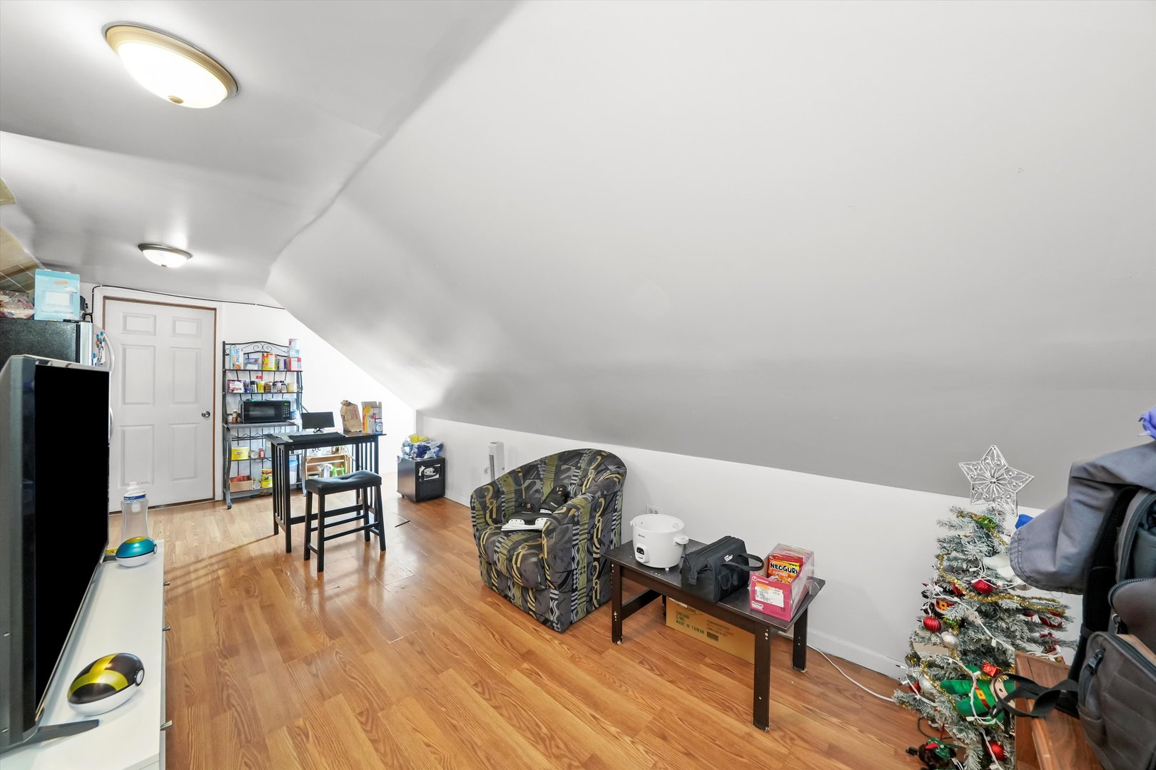 3020 South Pulaski Road Chicago, IL 60623 - Photo 32 of 44 a living room with furniture and a wooden floor