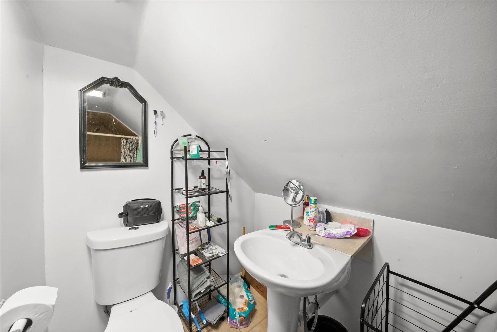 3020 South Pulaski Road Chicago, IL 60623 - Photo 36 of 44 a bathroom with a toilet a sink and mirror