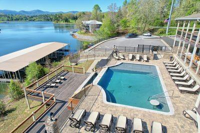 90 Winding Ridge Blairsville, GA 30512 - Photo 17 of 20 a view of a swimming pool with seating area and lake view