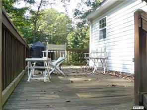 8009 Larkhaven Road Charlotte, NC 28216 - Photo 11 of 16 a view of a chair and tables in the balcony