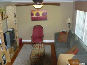 8009 Larkhaven Road Charlotte, NC 28216 - Photo 3 of 16 a living room with furniture and a flat screen tv