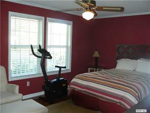 8009 Larkhaven Road Charlotte, NC 28216 - Photo 6 of 16 a bedroom with a bed and a window