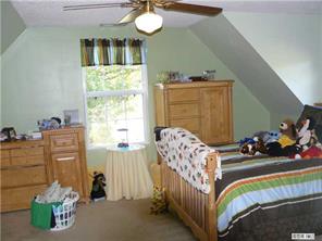 8009 Larkhaven Road Charlotte, NC 28216 - Photo 8 of 16 a bedroom with furniture and a large window