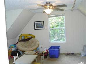 8009 Larkhaven Road Charlotte, NC 28216 - Photo 9 of 16 a living room with furniture and a window