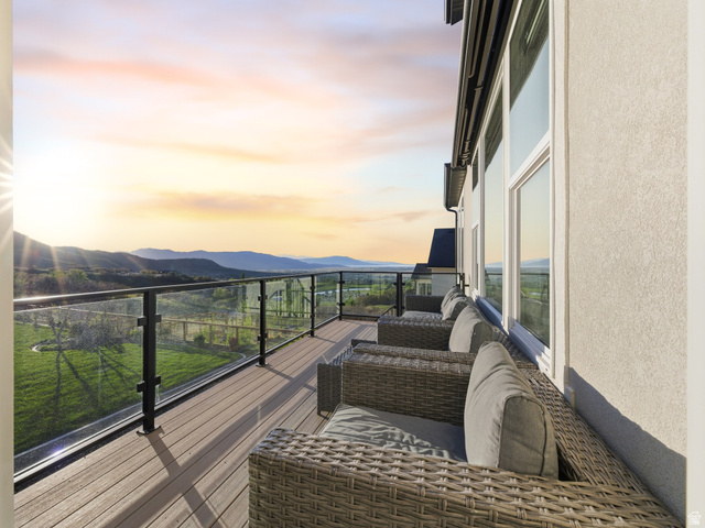 102 Elk Ridge Drive Elk Ridge, UT 84651 - Photo 33 of 61 Balcony at dusk featuring a mountain view