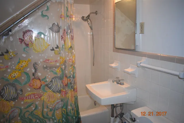 a room with water heater and a window