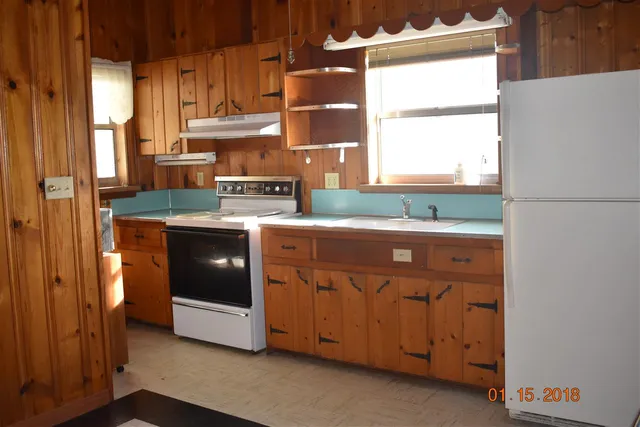 a view of a room with a window and stairs