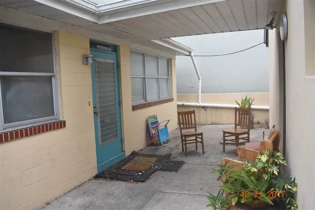 a bedroom with a bed and a desk