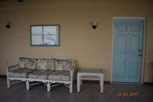a kitchen with granite countertop a refrigerator and a stove