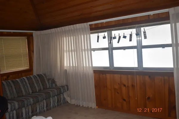 a view of a room with windows