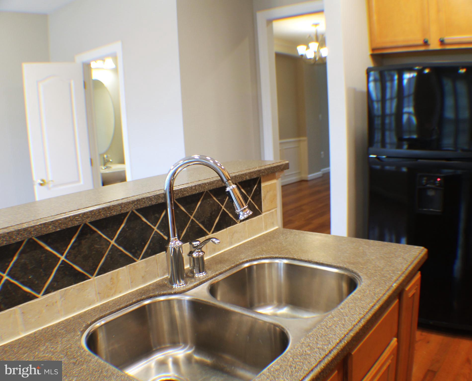 11837 Whitworth Cannon Lane Bristow, VA 20136 - Photo 21 of 63 a kitchen with a sink and a window