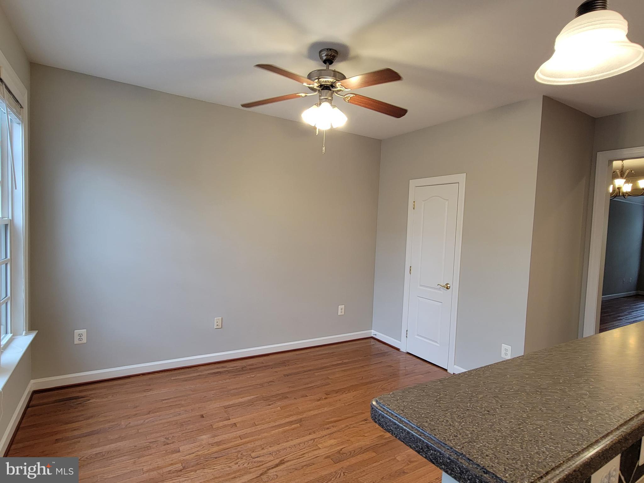 11837 Whitworth Cannon Lane Bristow, VA 20136 - Photo 27 of 63 wooden floor in an empty room with a window