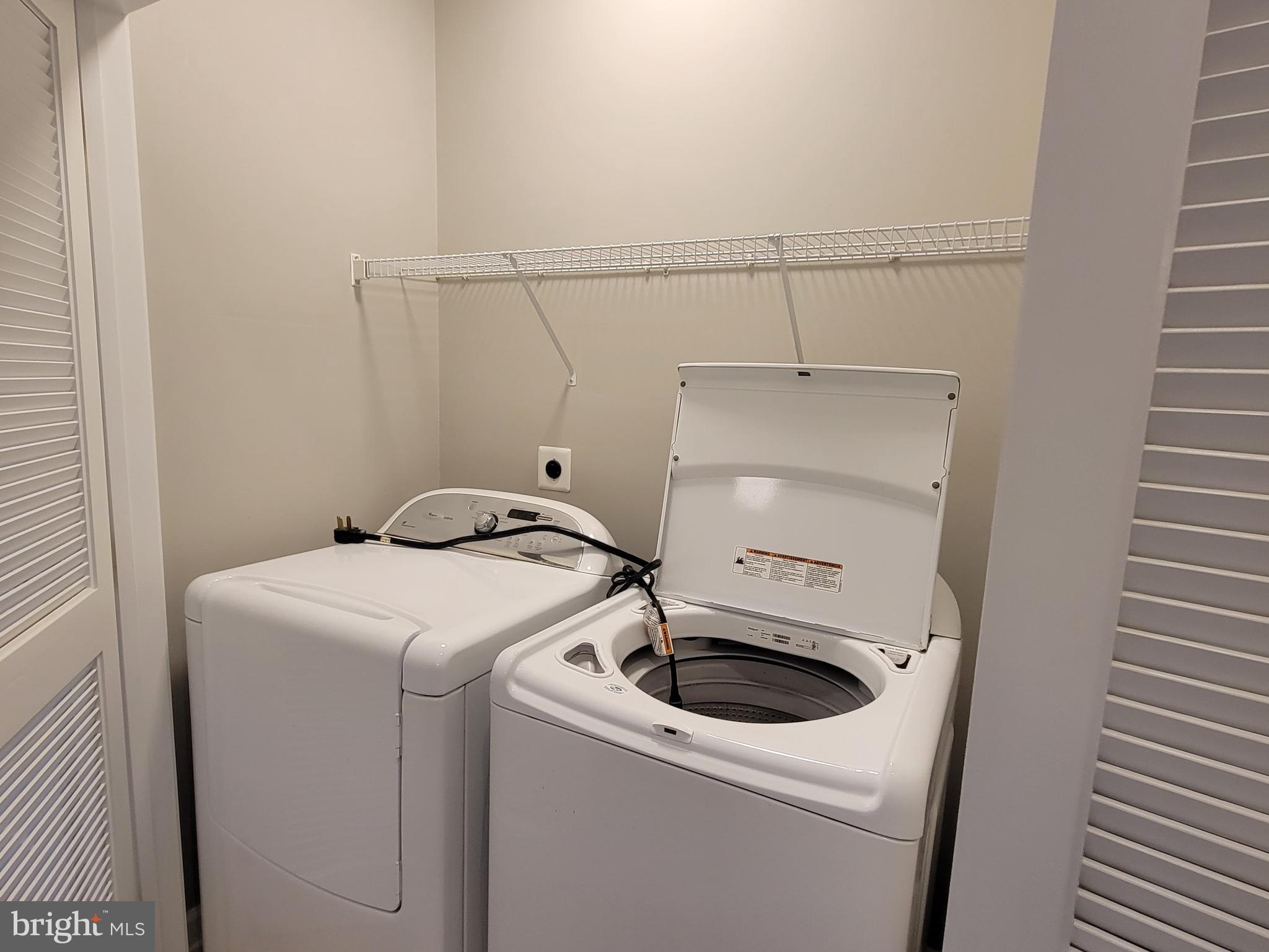 11837 Whitworth Cannon Lane Bristow, VA 20136 - Photo 38 of 63 a utility room with dryer and washer