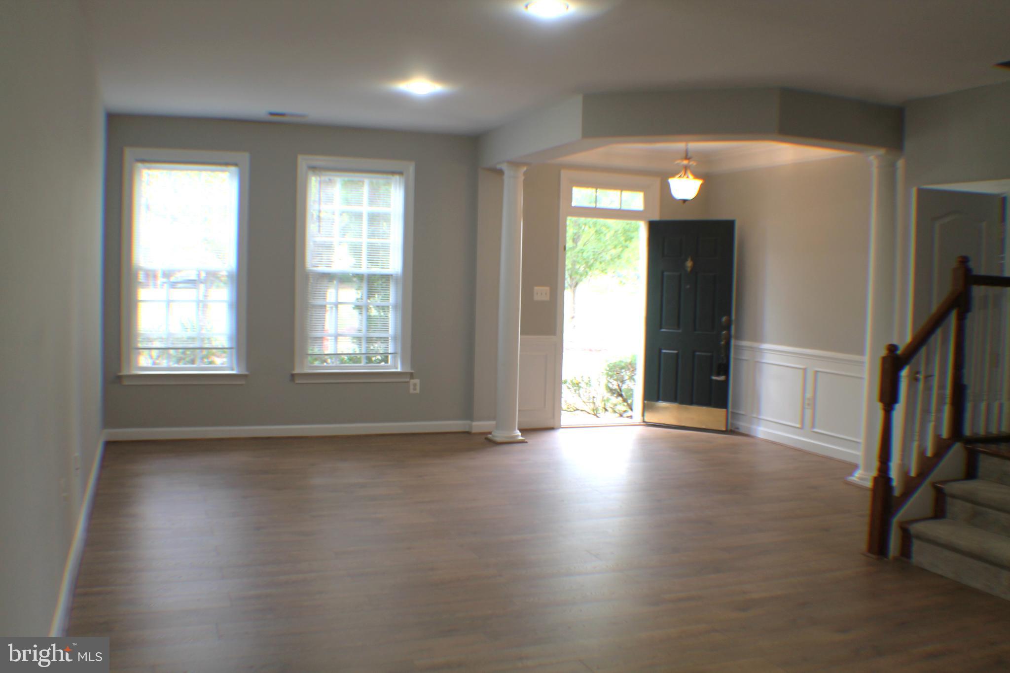 11837 Whitworth Cannon Lane Bristow, VA 20136 - Photo 5 of 63 an empty room with wooden floor and a window