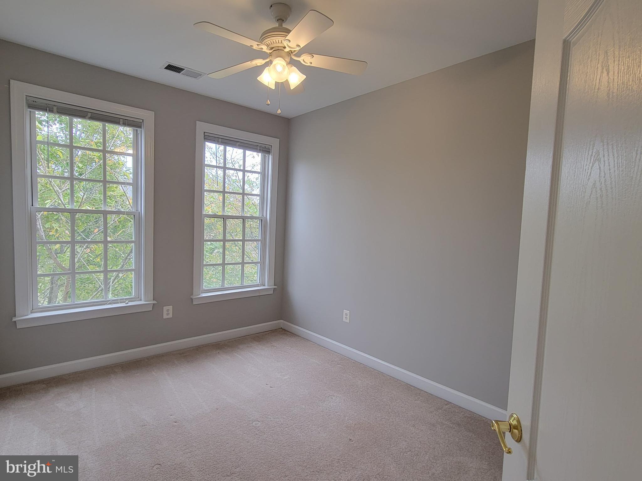 11837 Whitworth Cannon Lane Bristow, VA 20136 - Photo 51 of 63 wooden floor in an empty room with a window