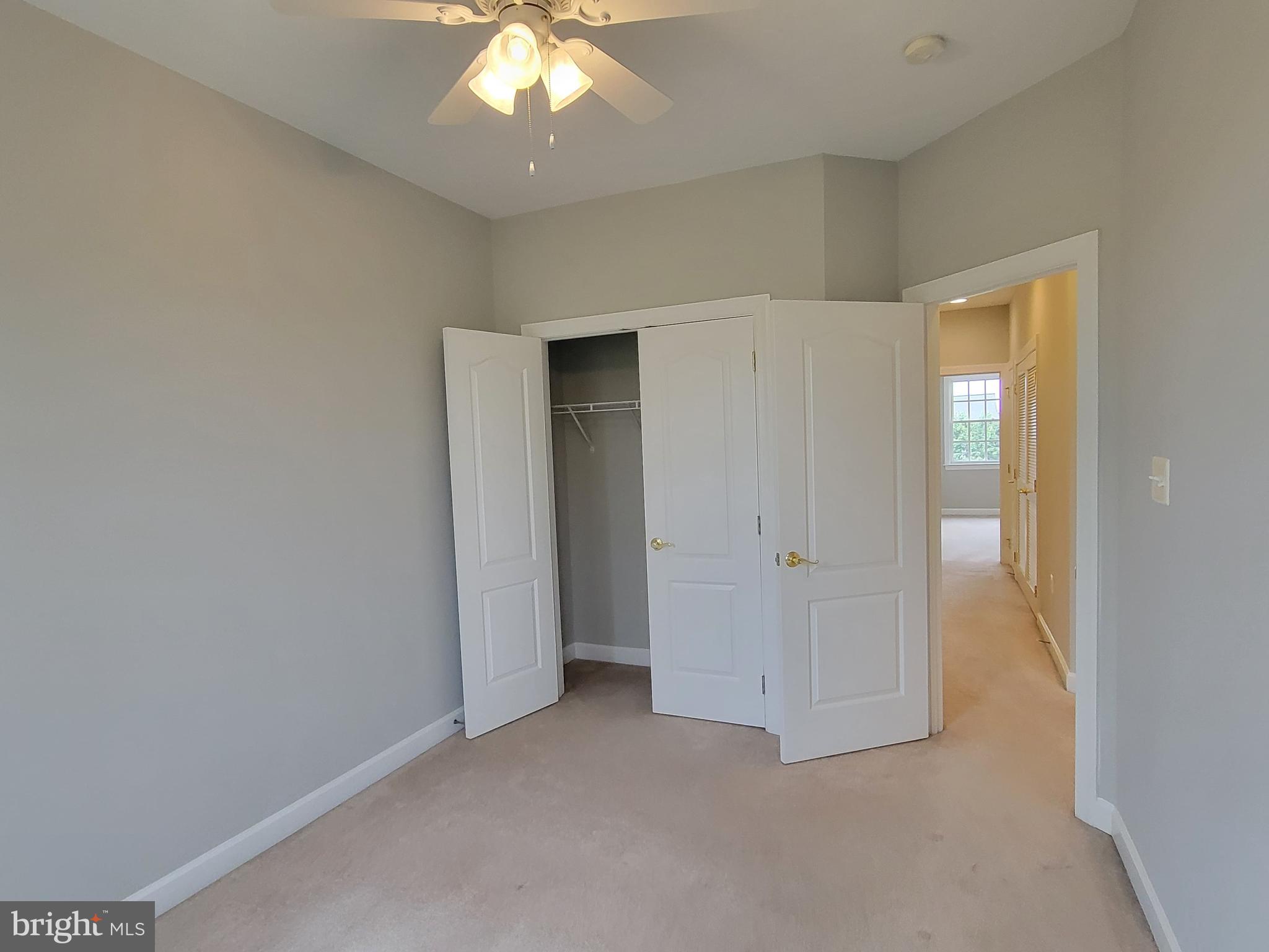11837 Whitworth Cannon Lane Bristow, VA 20136 - Photo 52 of 63 an empty room with a empty space and a ceiling fan