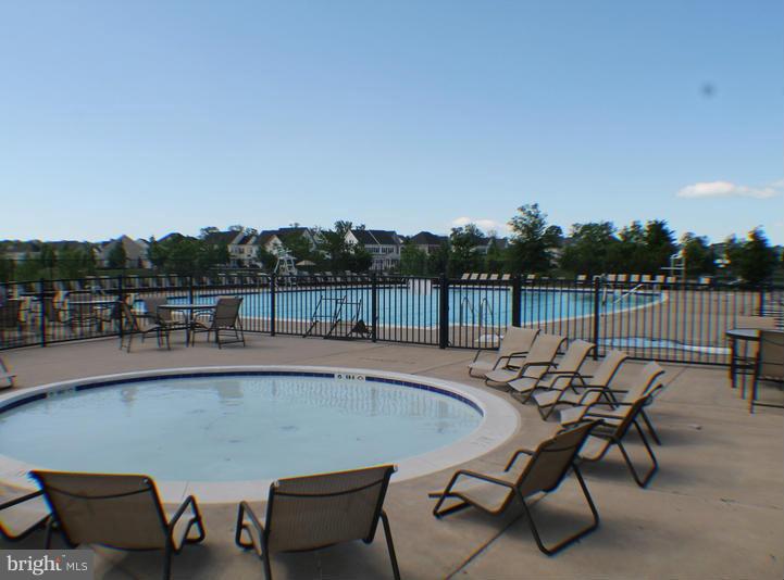 11837 Whitworth Cannon Lane Bristow, VA 20136 - Photo 62 of 63 a view of a chairs and table on the terrace