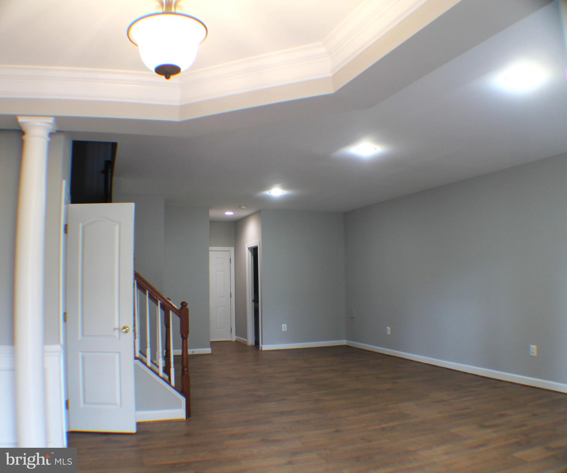 11837 Whitworth Cannon Lane Bristow, VA 20136 - Photo 7 of 63 a view of a hallway with wooden floor