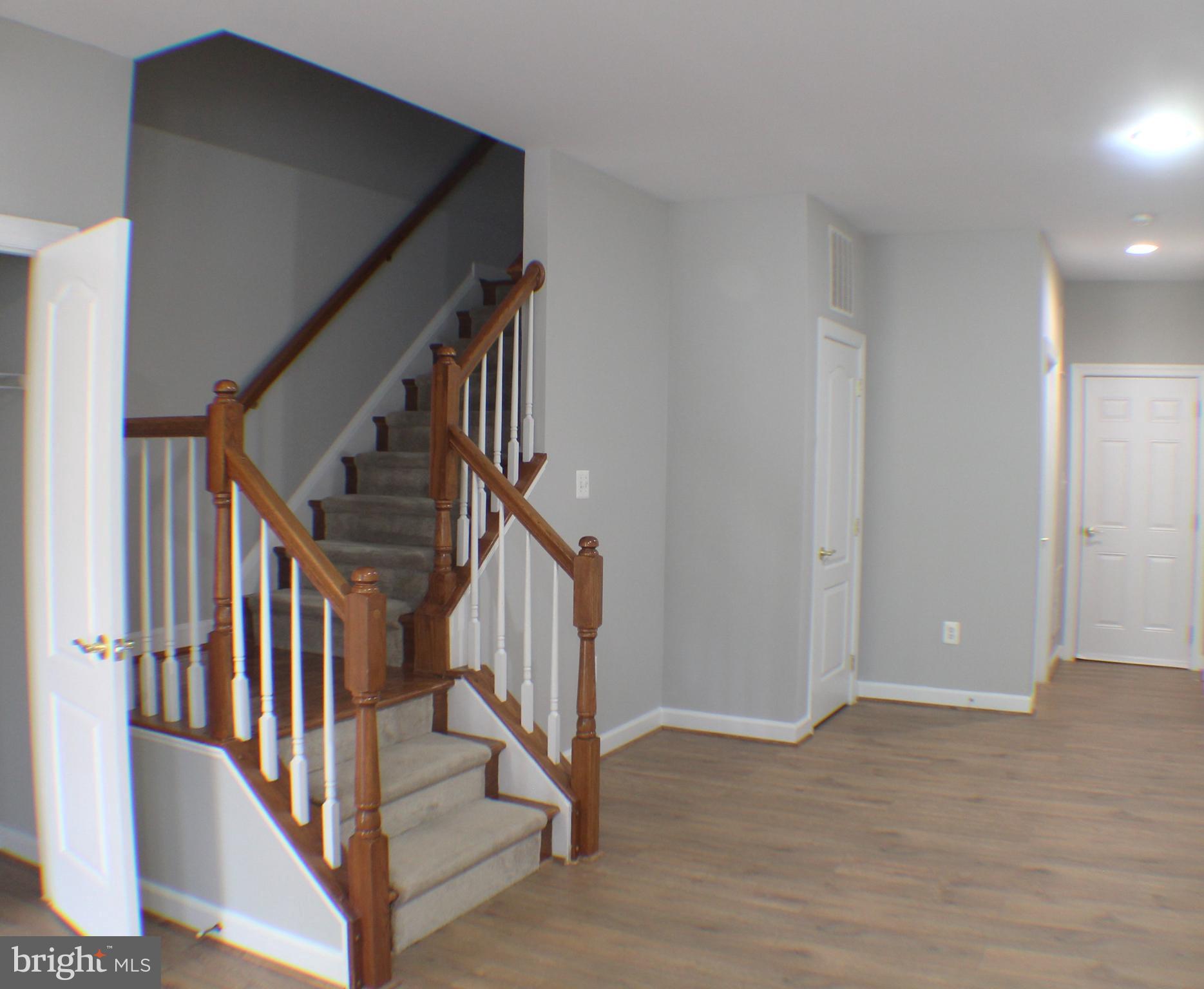 11837 Whitworth Cannon Lane Bristow, VA 20136 - Photo 9 of 63 a view of an entryway with wooden floor