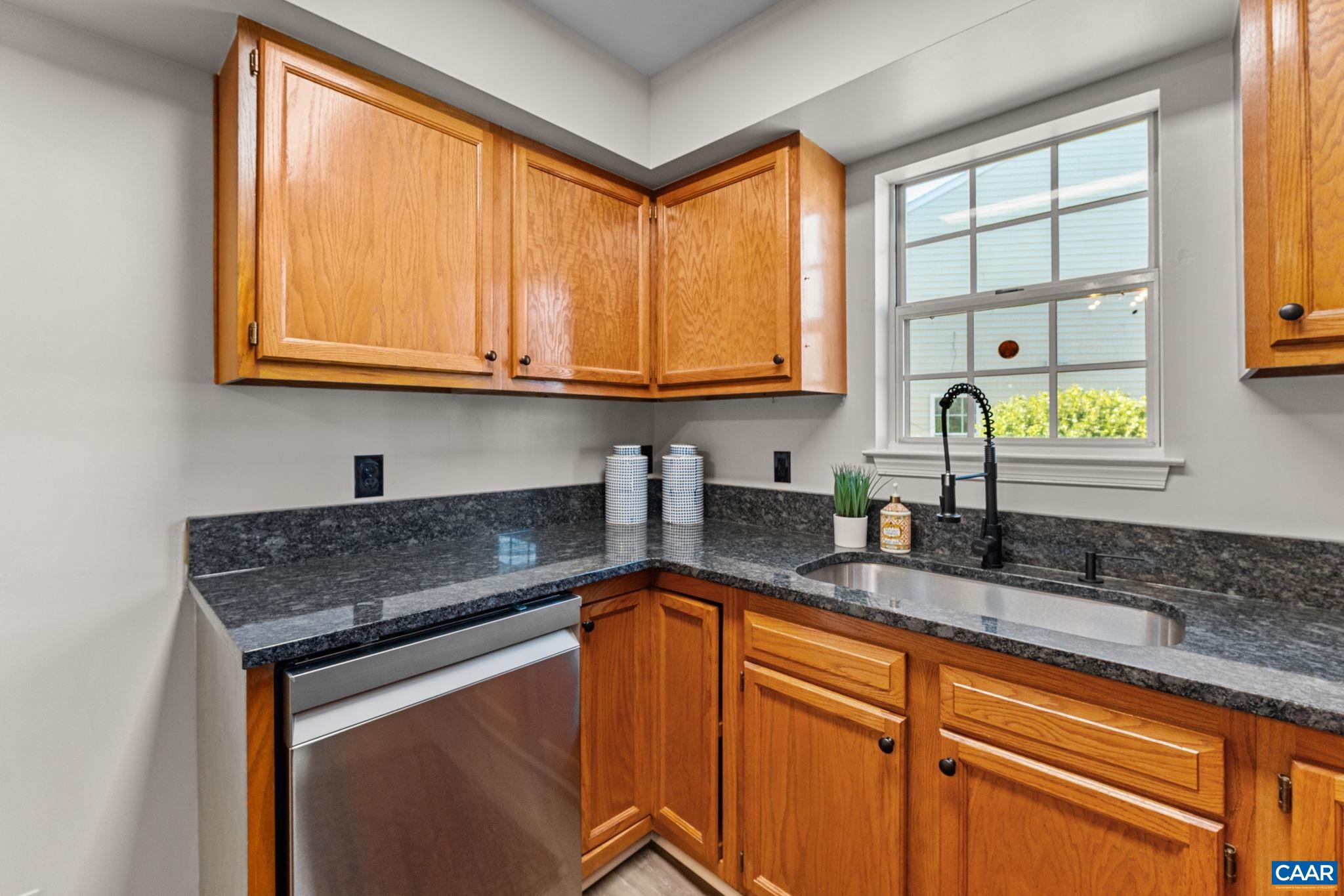 403 Riverside Avenue Charlottesville, VA 22902 - Photo 11 of 27 a kitchen with granite countertop cabinets and window