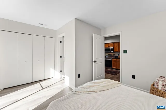 a bedroom with a bed and a closet